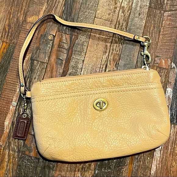 Coach Handbags - COACH nude beige wristlet with shoulder strap.